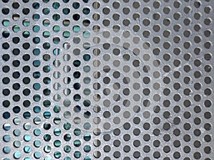 288 / 5.000Resultados de traducciÃÂ³nMetal panel background with holes. Perforated aluminum sheet metal. Full frame perforated photo