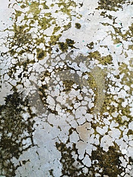 The resulting water seepage appears as faint white or light-colored patterns on the concrete surface.