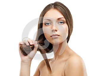 The results speak for themselves. A gorgeous young woman scrunching her hair while isolated on a white background.