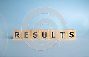 RESULTS word written on wood block, business concept