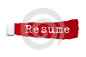 Resume word written under the curled piece of Red torn paper