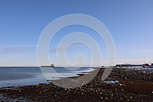 Resupply cargo barge on the waters of Nunavut near the community of Arviat