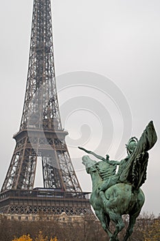 Resurgent France pointing to the Eiffel Tower in Paris