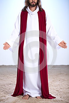 Resurrected Jesus standing on sand photo