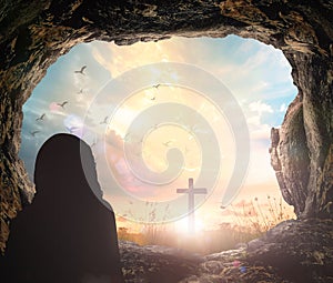 Jesus Christ is risen from tomb with cross photo