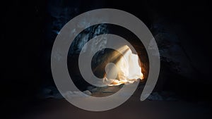 Resurrection. Inside of a cave with light and shadow on the ground