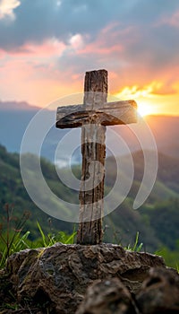 Resurrection symbol empty tomb stone with cross on meadow under beautiful sunrise scenery