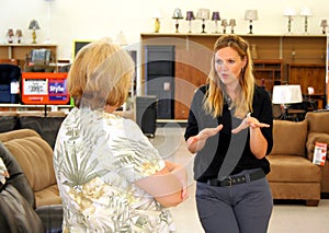 Retail Associate Helping Customer photo