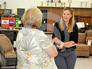 Retail Associate Helping Customer