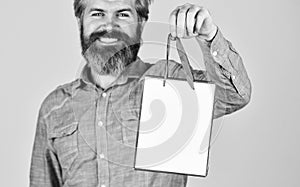 Retail concept. Hipster buying sale price. Cyber monday sale. Nice purchase. Bearded man hold shopping bags. Handsome