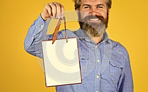 Retail concept. Hipster buying sale price. Cyber monday sale. Nice purchase. Bearded man hold shopping bags. Handsome