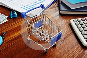 Retail marketing. Shopping cart on a desk