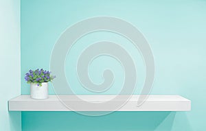 Retail shelf on light blue vintage background. fill objects.