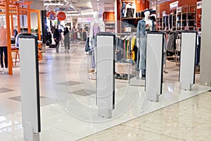 Retail shop electronic anti-theft gate system with sensor deters pilferage