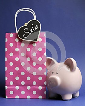 Retail Shopping Sale promotion with pink polka dot bag and piggy bank