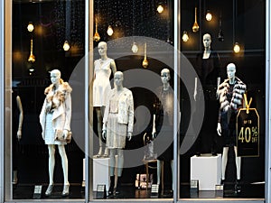 Retail store window with mannequins photo