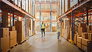 Retail Warehouse full of Shelves with Goods in Cardboard Boxes, Workers Walk, Scan and Sort Packag