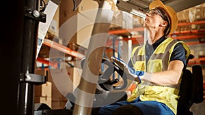 Retail Warehouse full of Shelves with Goods: Electric Forklift Truck Operator Lifts Pallet with Ca