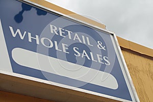 retail and whole sales caption writing text sign on store building