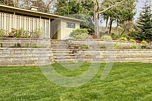 Retaining brick wall with steps and garage.. photo