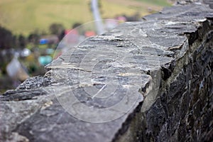 Retaining Wall Detail. Closeup of dry stone wall built with natural flagstones and wallstones of irregular shapes and sizes photo