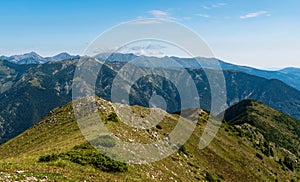 Retezat mountain range from Coada Oslei hill summit in Valcan mountains in Romania photo