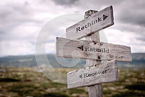 Rethink rebuild recover signpost outdoors