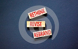 Rethink revise rebrand symbol. Concept word Rethink Revise Rebrand on beautiful block. Beautiful black table black background.