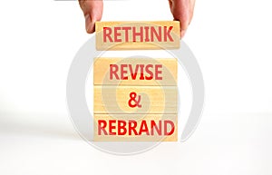 Rethink revise rebrand symbol. Concept word Rethink Revise and Rebrand on beautiful block. Beautiful white background. Business