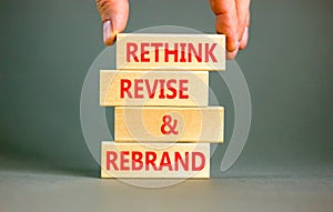Rethink revise rebrand symbol. Concept word Rethink Revise and Rebrand on beautiful block. Beautiful white background. Business
