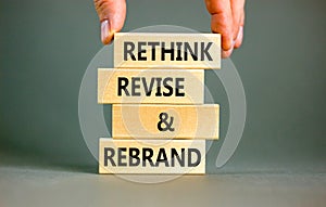 Rethink revise rebrand symbol. Concept word Rethink Revise and Rebrand on beautiful block. Beautiful white background. Business