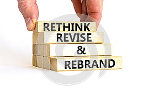 Rethink revise rebrand symbol. Concept word Rethink Revise and Rebrand on beautiful block. Beautiful white background. Business