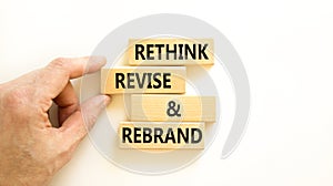 Rethink revise rebrand symbol. Concept word Rethink Revise and Rebrand on beautiful block. Beautiful white background. Business