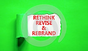 Rethink revise rebrand symbol. Concept word Rethink Revise and Rebrand on beautiful paper. Beautiful green paper background.