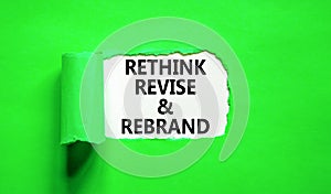 Rethink revise rebrand symbol. Concept word Rethink Revise and Rebrand on beautiful paper. Beautiful green paper background.