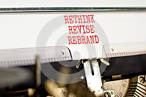 Rethink revise rebrand symbol. Concept word Rethink Revise Rebrand typed on retro typewriter. Beautiful white paper background.