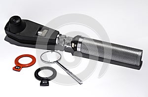 Retinoscope, cross cylinders and ophthalmic lenses photo