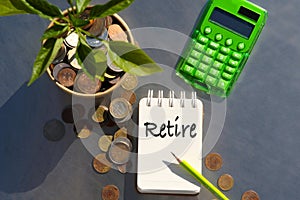 Retire. Concept for business, finance, money saving and investment. The plant grows in a container with coins.