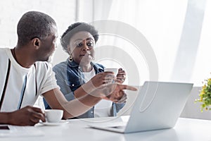 retired african american man pointing at