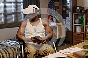 Retired African American Man Wearing VR Glasses and Holding Smartphone