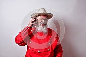 Retired American male listening to the tick-tock of his alarm clock photo