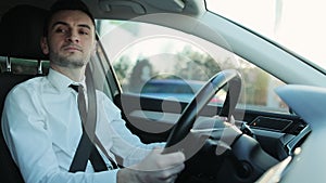 Retired business man driving car towards bright scenery sun pleasure shining over the road. Male driver traveling by