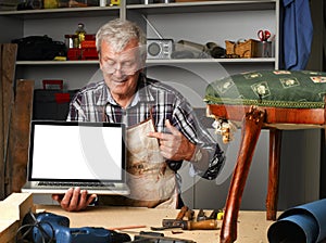 Retired carpenter with laptop