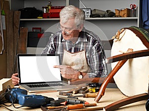 Retired carpenter with laptop