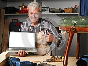 Retired carpenter with laptop