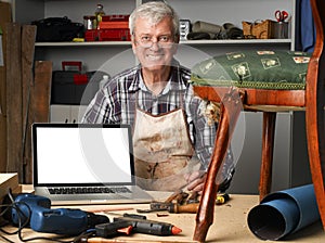 Retired carpenter with laptop