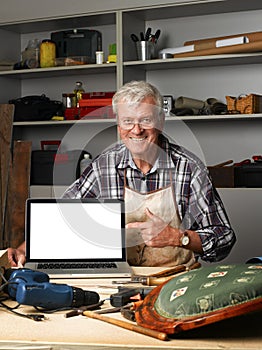 Retired carpenter with laptop