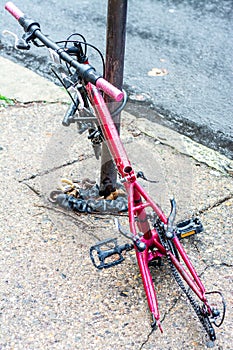 Retired city veteran - bicycle chained to a pole incapacitated. photo