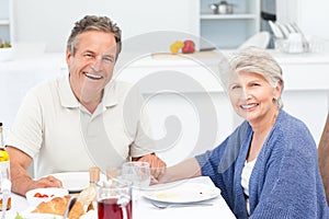 Retired couple eating in the kitchen