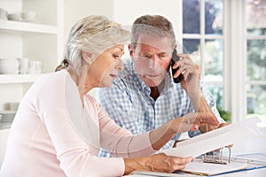 Retired couple with household bills